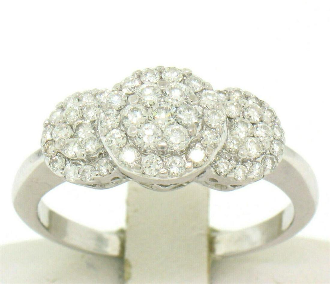 14k White Gold F VS2 1.25 ctw Triple Cluster Round Brilliant Diamond Band Ring: An estate solid 14k white gold band ring, with 52 round brilliant cut natural diamonds (F - VS2; 1.25ctw). The ring is size 9.0, weighs a total of 4.10 grams, and measures 8.72mm wide.