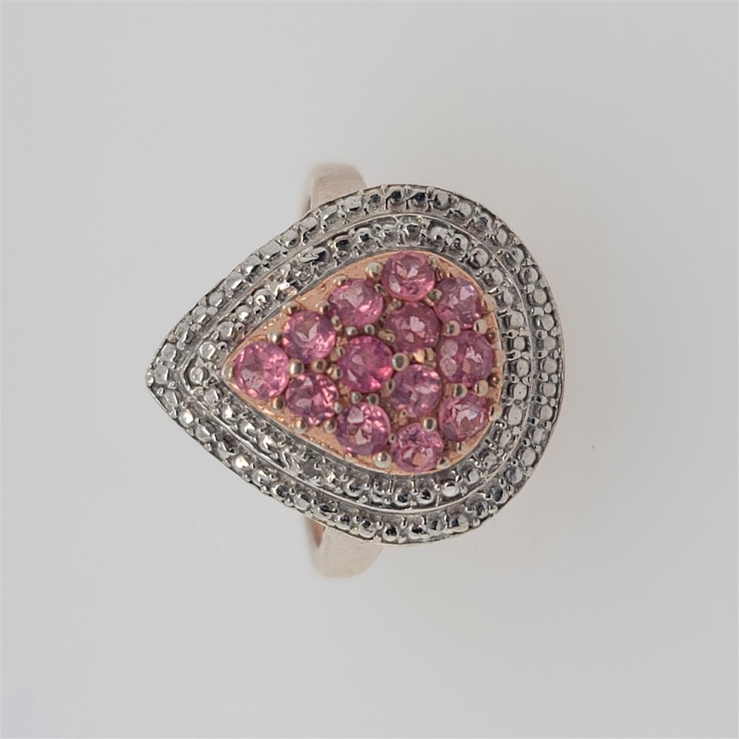 Sterling Silver Ring: One Sterling Silver Ring. The ring size is 10. Contains semiprecious stones.