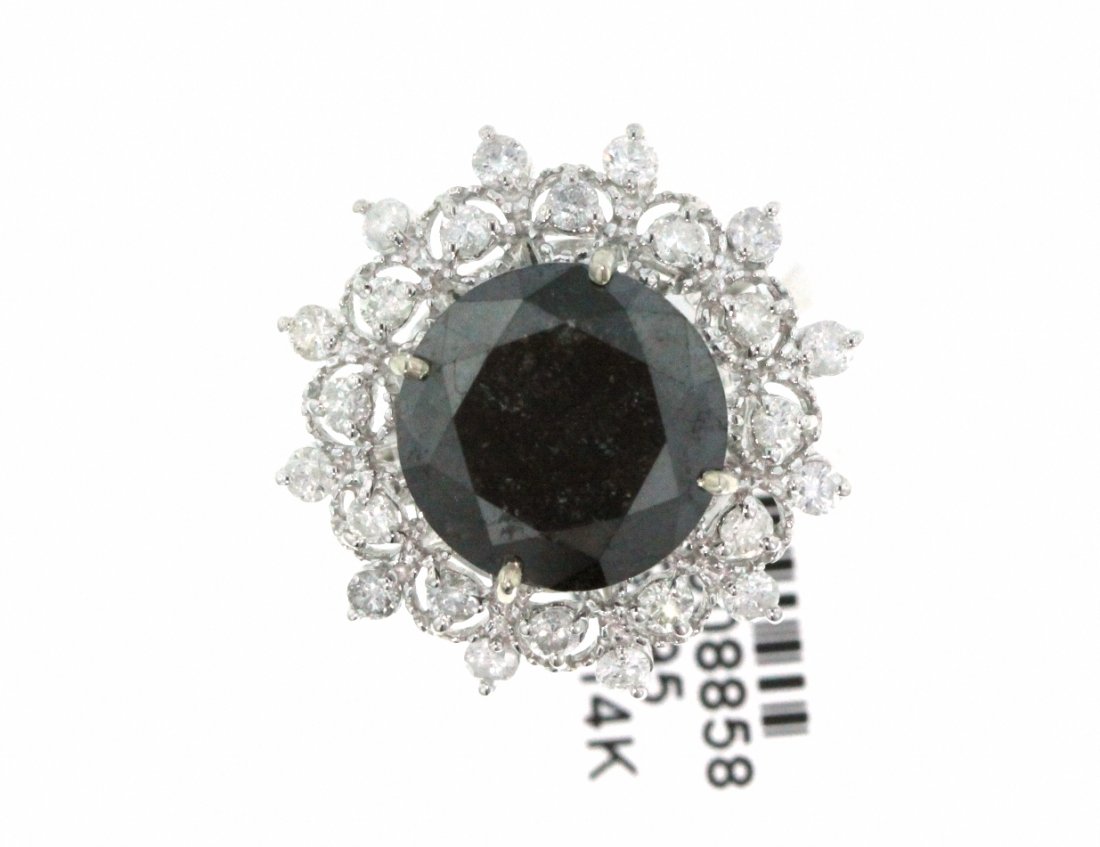 14KT White Gold 10.96ct Black & White Diamond Ring RM45: 14KT White Gold 10.96ct Black & White Diamond Ring RM459. New Condition! VO1661HQ. One electronically tested 14KT white gold ladies cast black and white diamond ring. Condition is new, good workmanshi