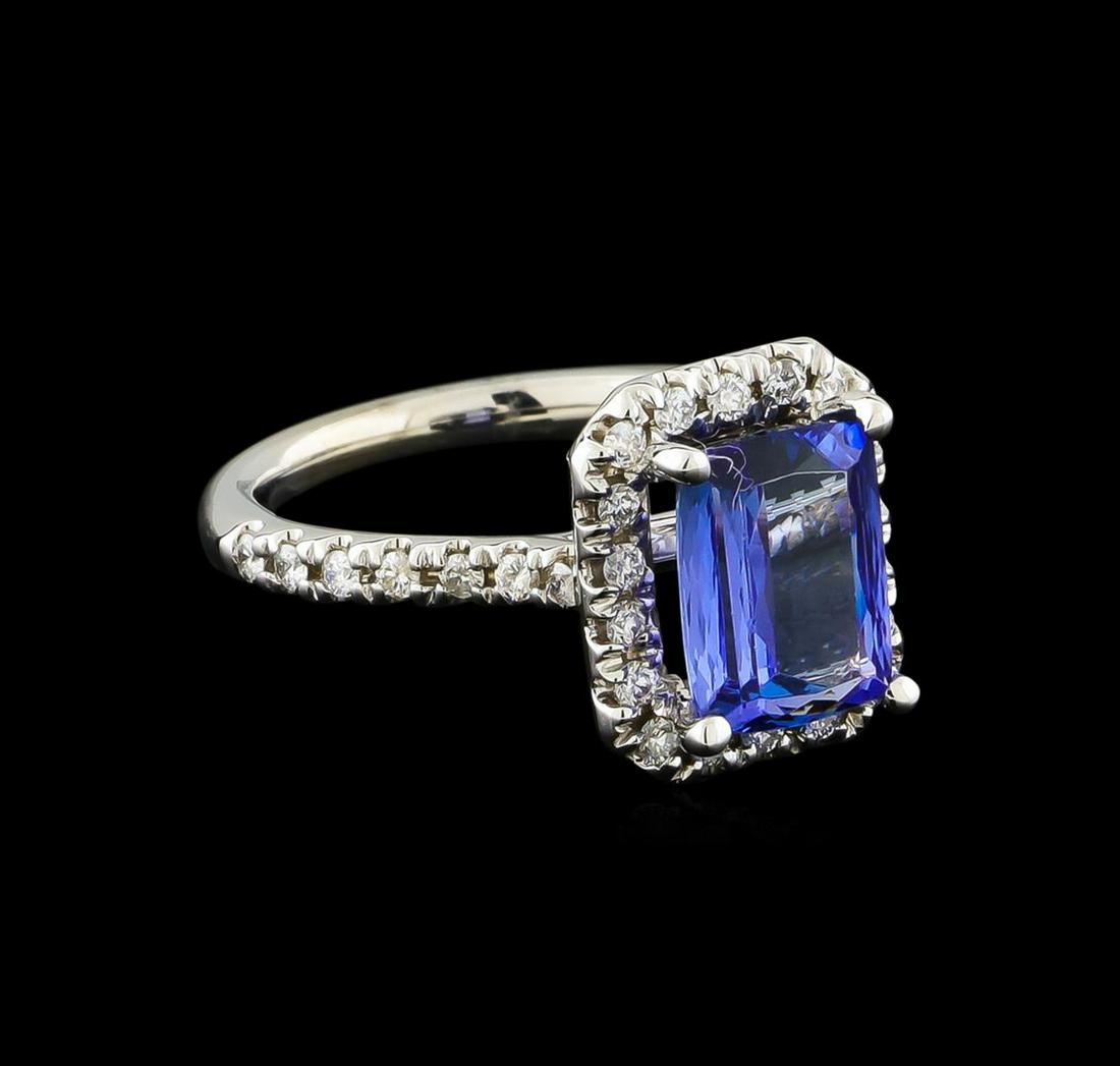 2.45 ctw Tanzanite and Diamond Ring - 14KT White Gold: One Ring featuring: 14KT White Gold weighing 3.96 grams containing one Tanzanite center stone with a total weight of 2.45ct and Diamonds with a total weight of 0.36ct.
