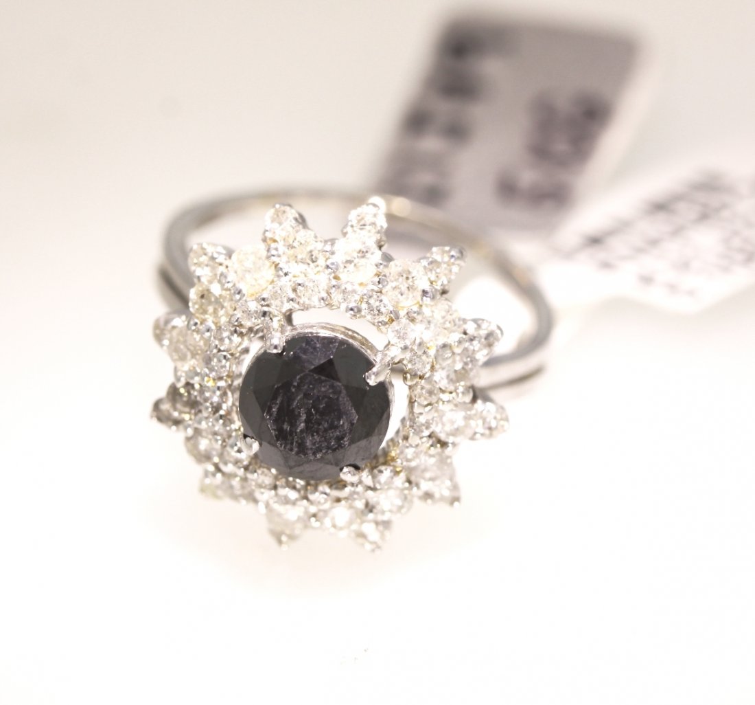 14KT White Gold 5.59ctw Black and White Diamond Ring RM: "14KT White Gold 5.59ctw Black and White Diamond Ring RM440. Excellent Condition! KW2701PL. One ladies polished, stamped and electronically tested solid 14k white gold ring mounted with: (1) Genuine 4