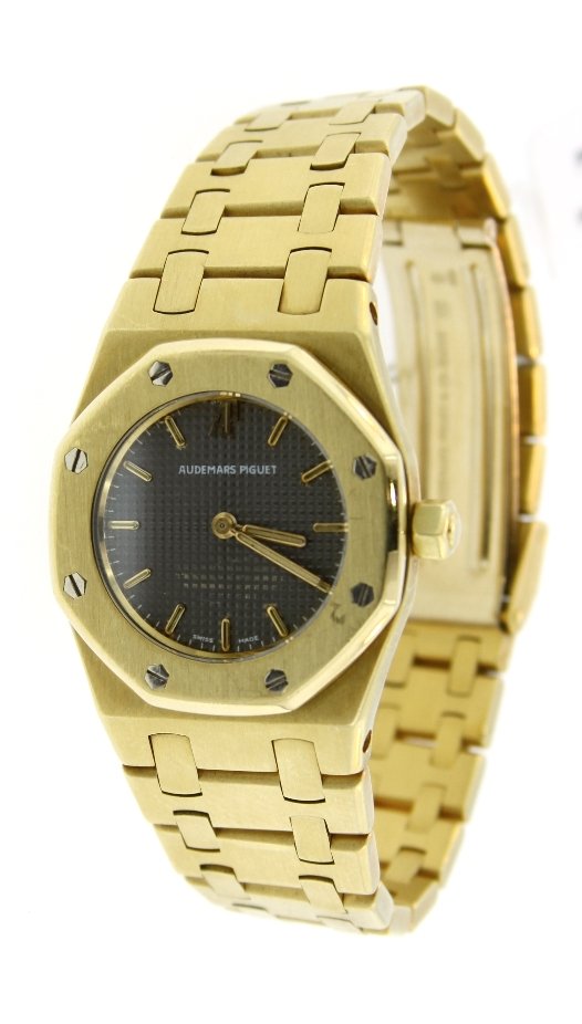 Ladies 18KT Yellow Gold Audemars Piguet Royal Oak Wrist: "Ladies 18KT Yellow Gold Audemars Piguet Royal Oak Wristwatch GB4. Great Condition! BV1014XR. One ladies 18KT Yellow Gold Audemars Piguet Royal Oak wristwatch featuring a grey dial, 26mm case, 18KT ye