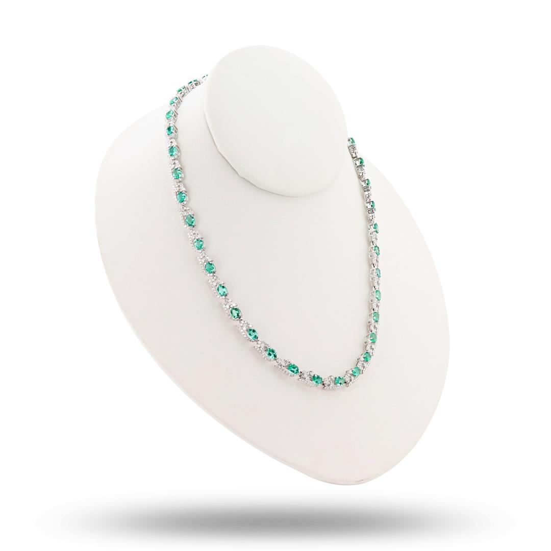 11.63 ctw Emerald and 6.37 ctw Diamond 14K White Gold Necklace: One polished, stamped, and nested 14K white gold necklace mounted with: 37 genuine faceted emeralds weighing approximately 11.63 carats, and 629 genuine round diamonds weighing approximately 6.37 cara