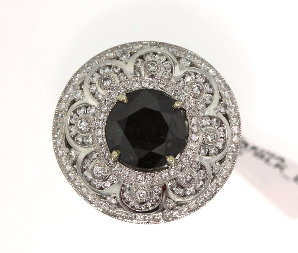 14KT White Gold 10.32ct Black & White Diamond Ring RM52: 14KT White Gold 10.32ct Black & White Diamond Ring RM525. Excellent Condition! TP1002QM. One electronically tested 14KT white gold ladies cast black & white diamond ring. Condition is new, good workma