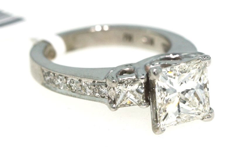 14KT White Gold 3.05ct Diamond Wedding Ring WNK18: 14KT White Gold 3.05ct Diamond Wedding Ring WNK18. New Condition! RC10271TM. One ladies' diamond wedding ring, stamped and tested 14KT white gold and contains one princess cut center diamond, two prin