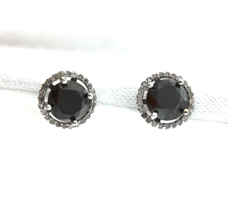 14KT White Gold 7.00ct Black & White Diamond Earrings R: "14KT White Gold 7.00ct Black & White Diamond Earrings RM510. Excellent Condition! BD778LB. One electronically tested 14KT white gold ladies cast & assembled black and white diamond earrings with stan