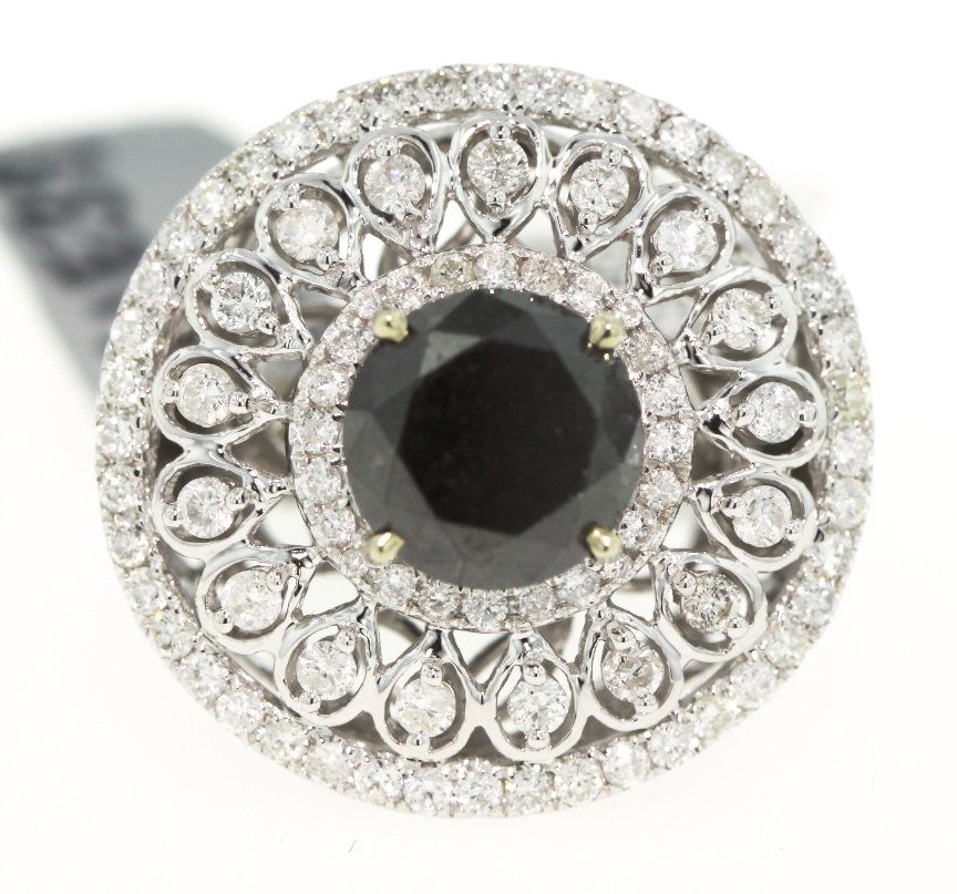 14KT White Gold 7.13ct Black and White Diamond Ring RM2: 14KT White Gold 7.13ct Black and White Diamond Ring RM224. Great Condition! RA9381TL. One electronically tested 14KT white gold ladies cast black and white diamond ring with a bright polish finish. Go