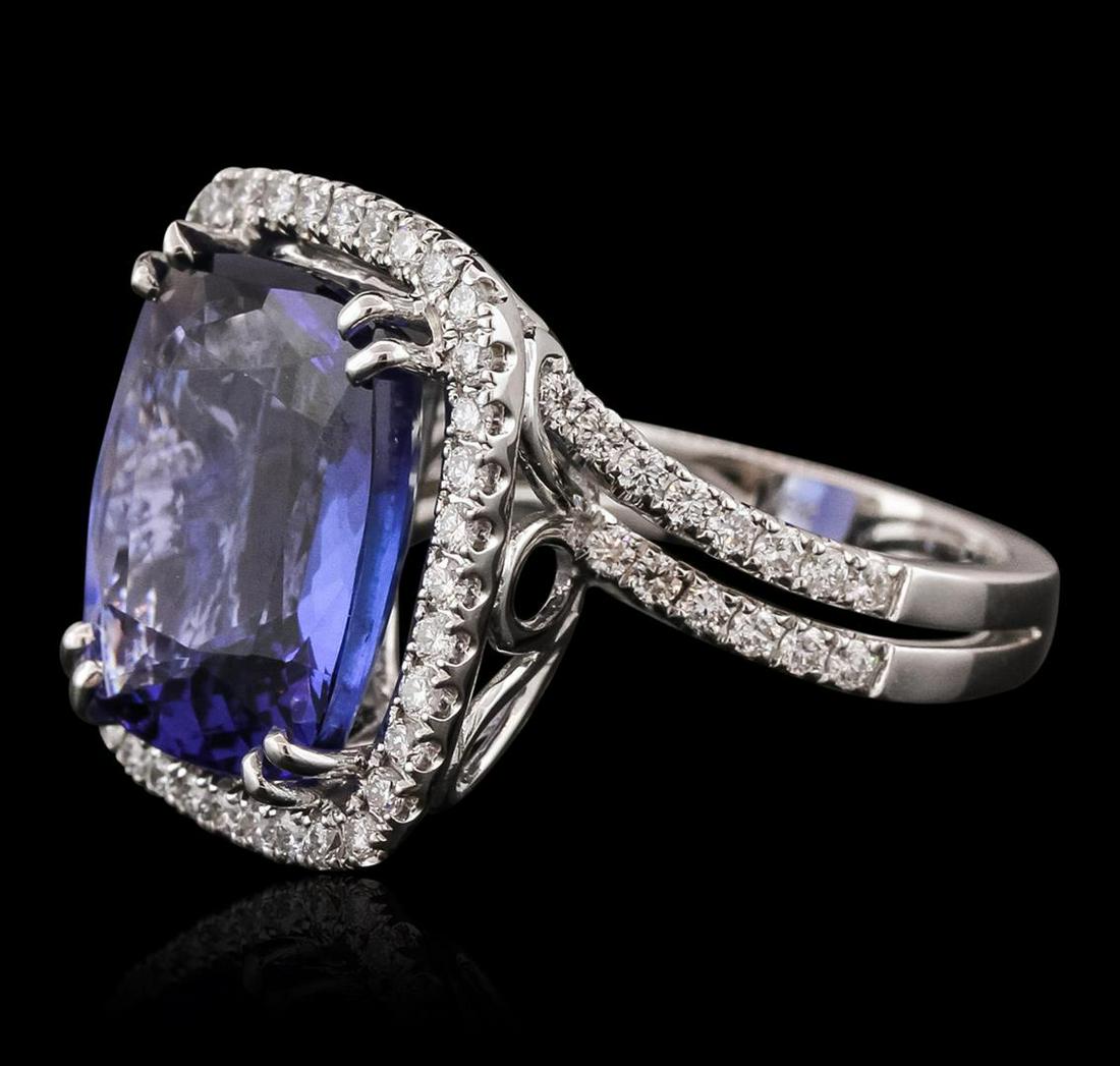 18KT White Gold GIA Certified 10.65 ctw Tanzanite and Diamond Ring: One electronically tested 18KT white gold ladies combination cast & assembled prong set ring with a split shank with a bright polish finish. Identified with markings of "750 UCG". Condition is new. Co