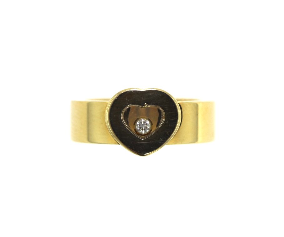 18KT Yellow Gold Chopard Heart Diamond Ring GB32: 18KT Yellow Gold Chopard Heart Diamond Ring GB32. Great Condition! NZ177KS. One 18KT yellow gold Chopard heart ring with floating diamond. Size is approximately 5.5. Weight: 13.0g. Width: 8mm on top.