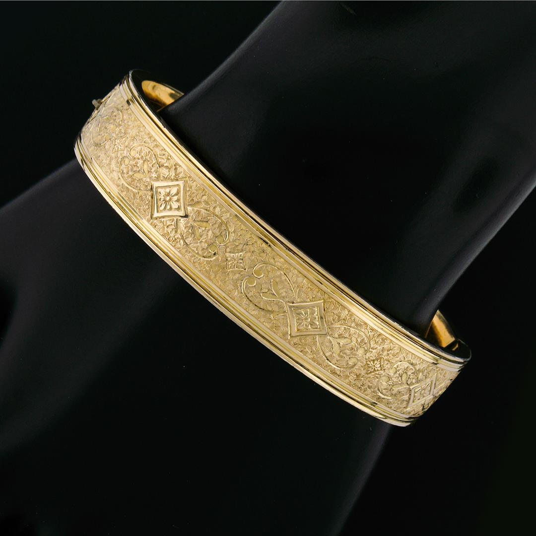 Antique 10K Gold Filled Hand Etched Detailed Textured Hinge Open Bangle Bracelet: An antique 1937 10k yellow gold filled textured hinge open bangle bracelet. It weighs a total of 18.4 grams, measures 6.50mm wide, and measures 7 inches in length.
