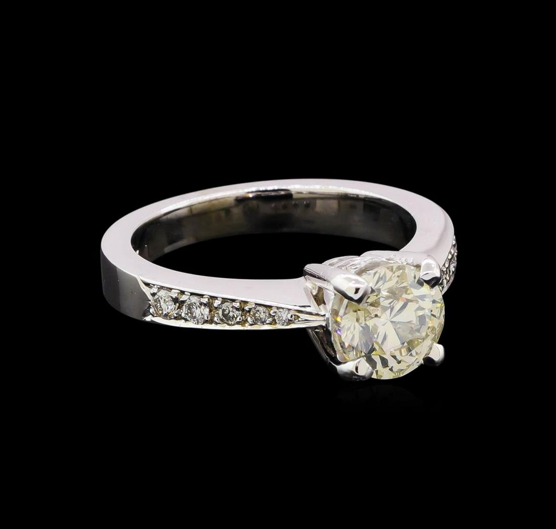 1.67 ctw Diamond Ring - 14KT White Gold: One electronically tested 14KT white gold lady's cast wedding ring with a cathedral shank with a bright polish finish. Featured lady's ring has a shank measuring 3.00 millimeters in width. Identified