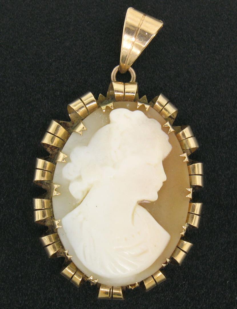 Antique Victorian 14k Gold Hand Carved Shell Oval Cameo Pendant w/ Curled Frame: A victorian solid 14k yellow gold cameo pendant, with 1 oval shape carved shell. The pendant weighs a total of 4.70 grams, measures 40.94x24.39mm including the bail.