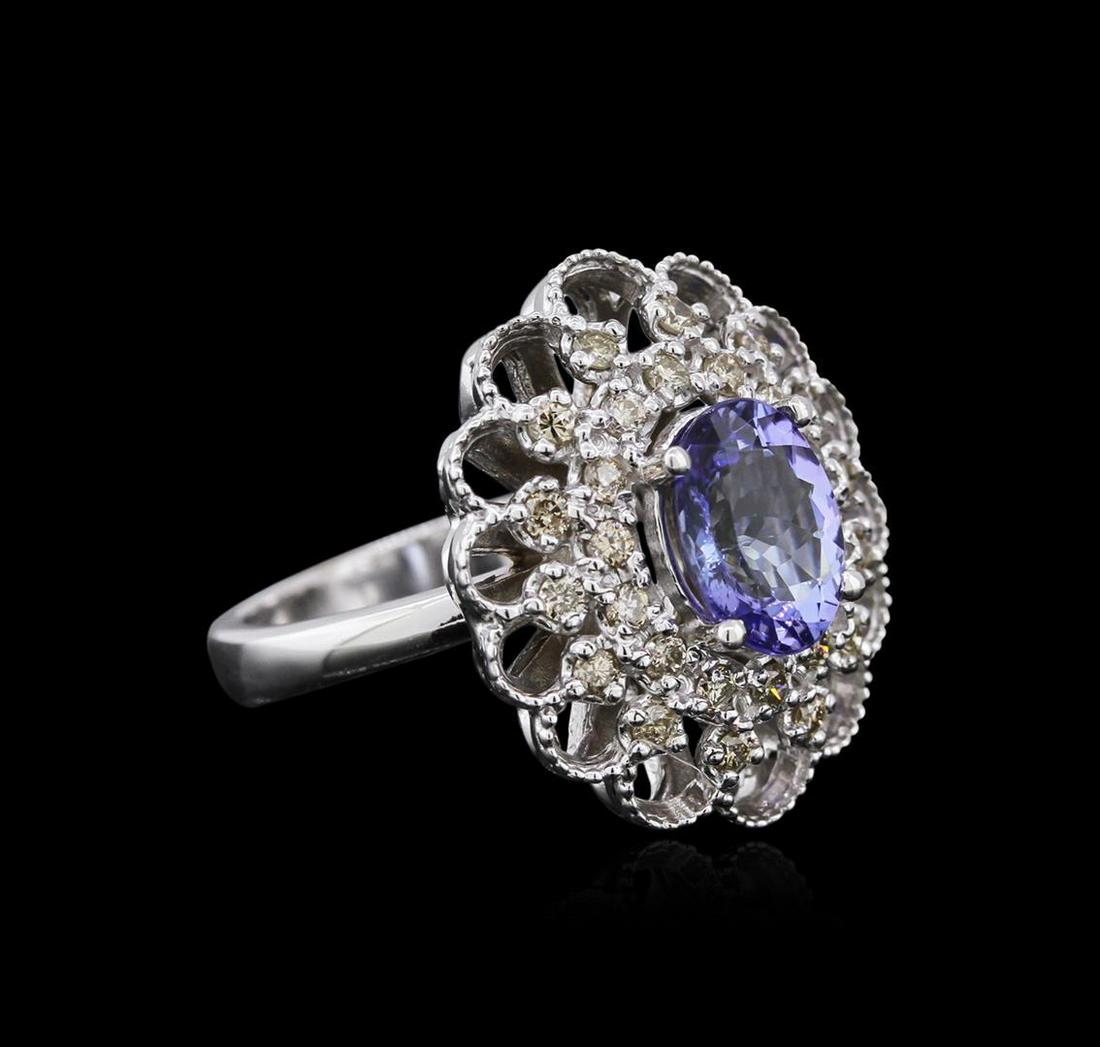 14KT White Gold 2.12 ctw Tanzanite and Diamond Ring: One electronically tested 14KT white gold ladies cast tanzanite and diamond ring with a tapered shank with a bright polish finish. Identified with markings of "14K". Condition is new. Containing: One 