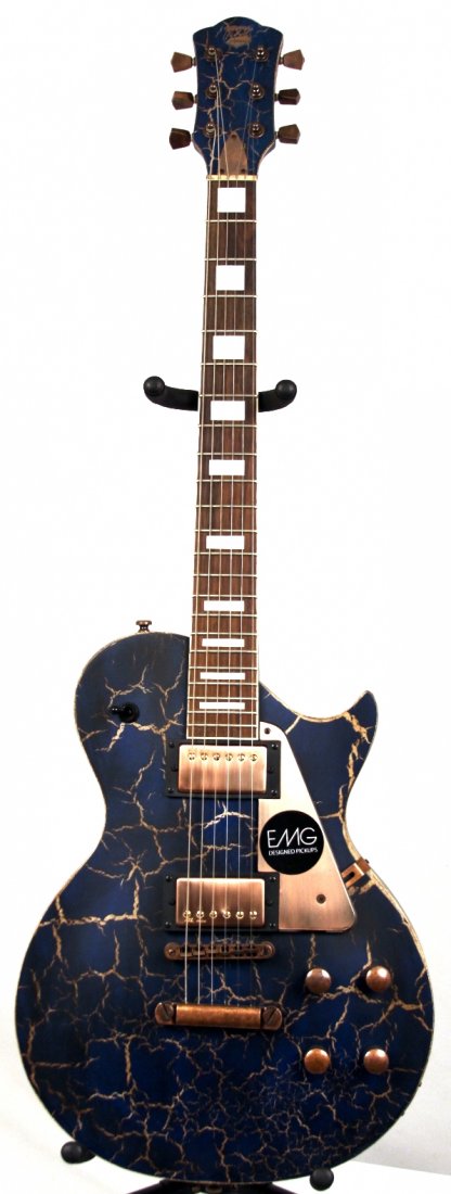 AXL Badwater 1216 Electric Guitar in Blue Crackle DGUI8: AXL Badwater 1216 Electric Guitar in Blue Crackle DGUI83. New Condition! XC951WE. The Badwater 1216 in blue crackle is built with a solid mahogany set neck, 2 Alnico humbuckers and a classic-style sin