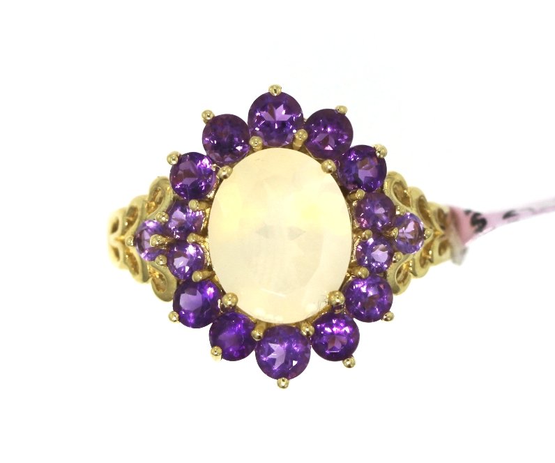 14KT Yellow Gold Moonstone & Amethyst Ring FJM1753: 14KT Yellow Gold Moonstone & Amethyst Ring FJM1753. Excellent Condition! NG112HF. 14KT Yellow Gold Moonstone & Amethyst Ring. Ring contains 16 amethyt stones and 1 moonstone. Total weight of ring is 5