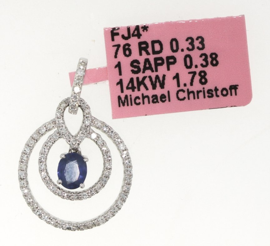 14KT White Gold Sapphire and Diamond Circles Pendant FJ: 14KT White Gold Sapphire and Diamond Circles Pendant FJM1158. Excellent Condition! TC252ES. One 14KT white gold Michael Christoff sapphire and diamond circles pendant. Features one sapphire weighing 0
