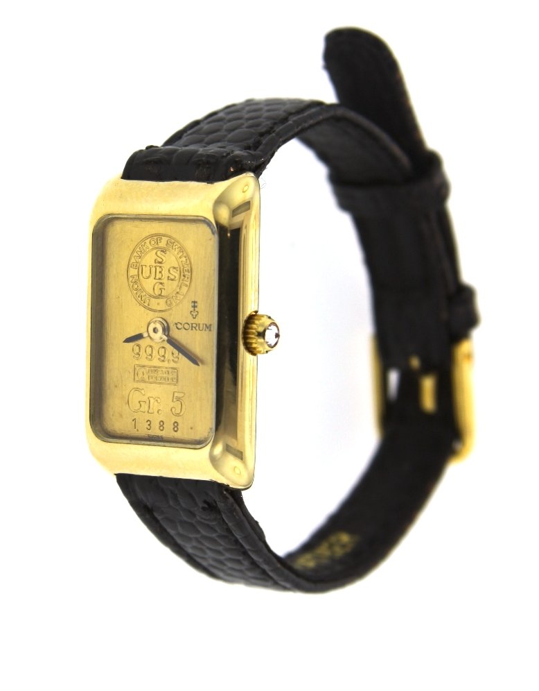 Ladies 18KT Yellow Gold Corum 5 Gram Swiss UBS Ingot Wa: Ladies 18KT Yellow Gold Corum 5 Gram Swiss UBS Ingot Watch A3827. Good Condition! KX169GH. One ladies Corum 5 Gram Swiss UBS 18KT yellow gold Ingot watch. This classic & distinctive watch is a collect