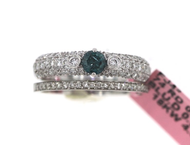 18KT White Gold 1.00tcw Blue & White Diamond Ring Set F: 18KT White Gold 1.00tcw Blue & White Diamond Ring Set FJM1659. Excellent Condition! DL828NE. One ladies 18KT white gold diamond ring set. Total weight of blue diamonds is 0.32ct. Total weight of white