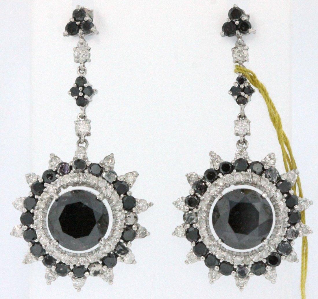 14KT White Gold 13.35ct Black & White Diamond Earrings : 14KT White Gold 13.35ct Black & White Diamond Earrings RM455. New Condition! ZD3891UL. One pair electronically tested 14KT white gold ladies cast & assembled black and white diamond earrings with pier