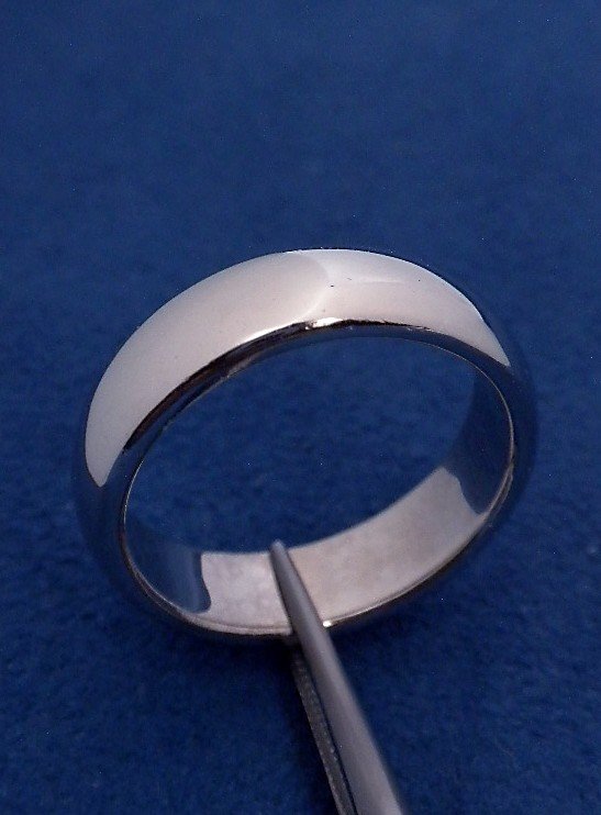 Platinum Tiffany and Co Band Ring WNK2: Platinum Tiffany and Co Band Ring WNK2. Good Condition! NC1001TZ. One electronically tested platinum cast six millimeter wide band with a bright polish finish. Trademark is Tiffany & Co. Identified wi