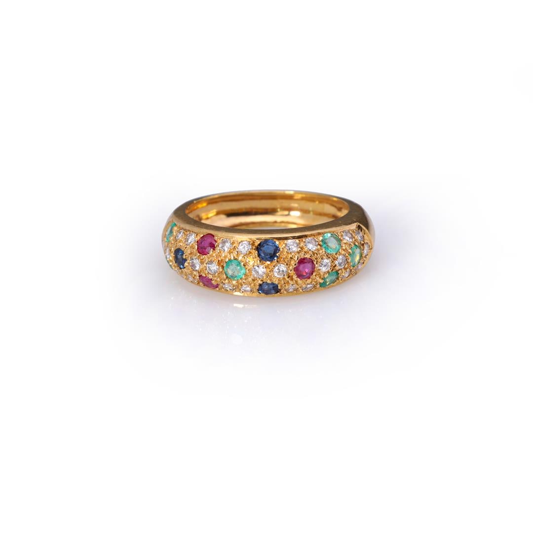18k Yellow Gold Sapphire, Ruby, Emerald & Diamond Ring: A handmade 18k yellow gold ring, pave set with three rows of diamonds offset with rubies, emeralds and sapphires, the interior of the ring marked 750 18K; gross weight 4.4 g, size 6