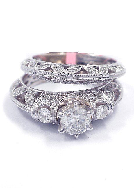 18KT White Gold 1.16tcw Diamond Wedding Ring Set FJM167: 18KT White Gold 1.16tcw Diamond Wedding Ring Set FJM1675. Excellent Condition! YC169MN. One electronically tested 18KT white gold ladies diamond wedding set with a bright polish finish. Condition is n