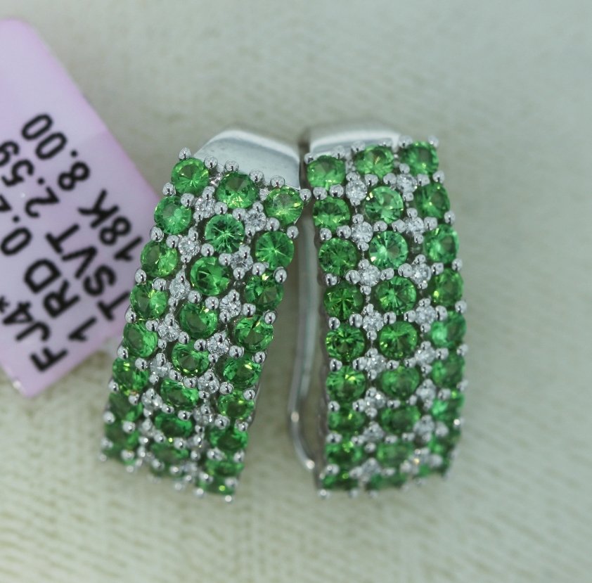 18KT White Gold 2.59ct Tsavorite & Diamond Earrings FJM: 18KT White Gold 2.59ct Tsavorite & Diamond Earrings FJM1592. Excellent Condition! YK663XN. One pair of 18KT White Gold 2.59ct Tsavorite & Diamond Earrings. Total weight of diamonds is 0.28ct. Total we
