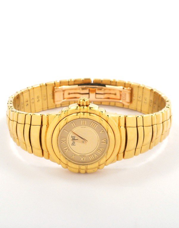 18KT Yellow Gold Piaget Tanagra Wristwatch A3851: 18KT Yellow Gold Piaget Tanagra Wristwatch A3851. Great Condition! FD1505MP. One, custom cast & assembled Piaget Tanagra 18KT yellow gold wristwatch electronically tested, Case: 25mm, Bezel: pattern c