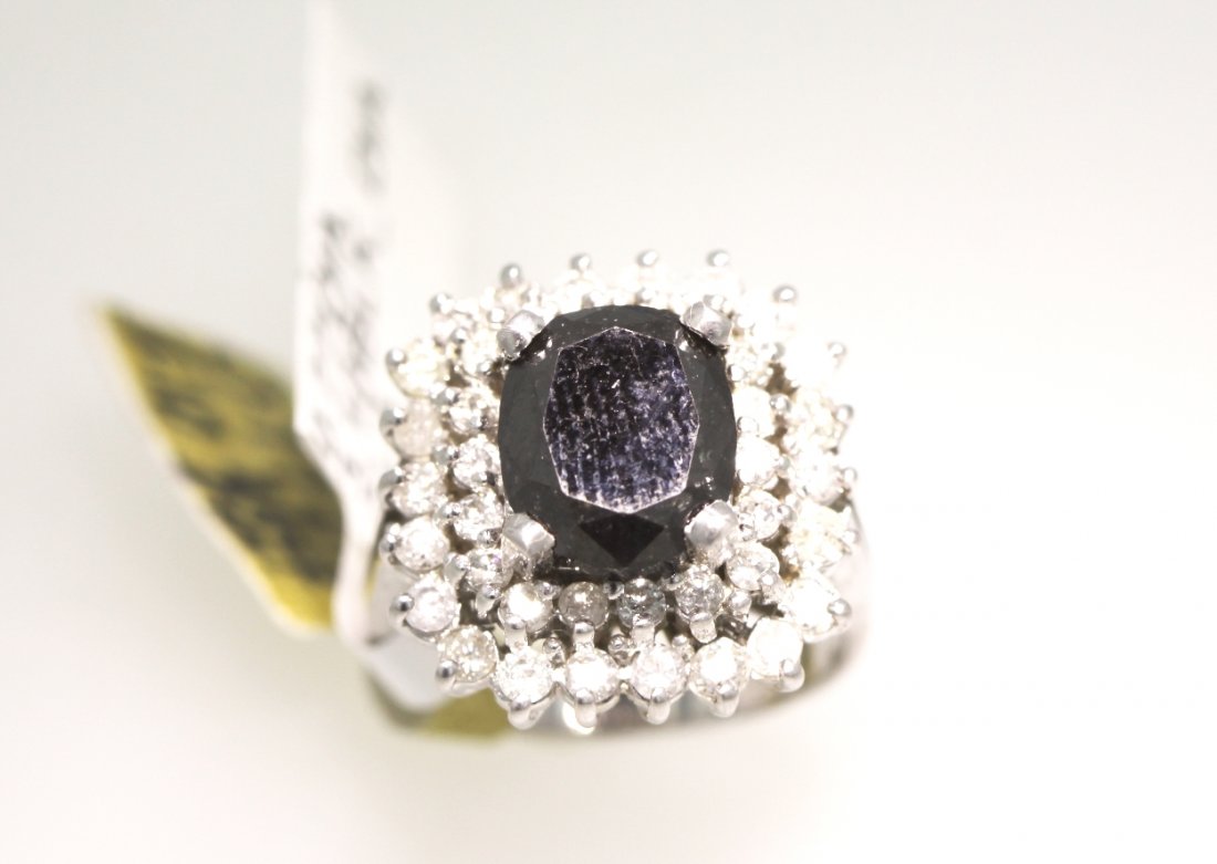 14KT White Gold 3.87ct Black and White Diamond Ring RM4: 14KT White Gold 3.87ct Black and White Diamond Ring RM436. Excellent Condition! LK757ER. One ladies polished, stamped and electronically tested solid 14k white gold ring mounted with: (1) Genuine 3.10