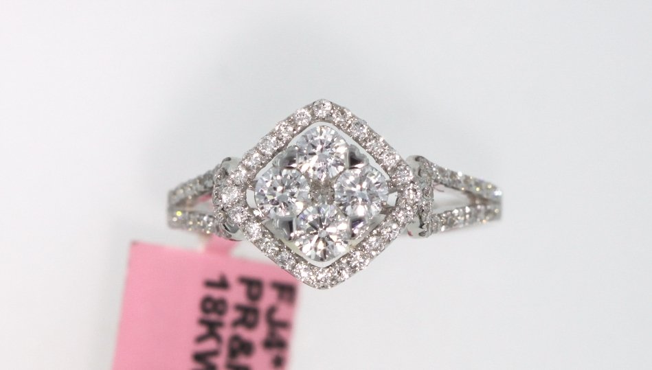 18KT White Gold 0.88ct Princess & Round Diamond Ring FJ: 18KT White Gold 0.88ct Princess & Round Diamond Ring. FJM1371. Excellent Condition! RS458NS. This beautiful 18KT White Gold Ring features (71) Princess & Round Cut Diamond(s) weighing approximately 0.