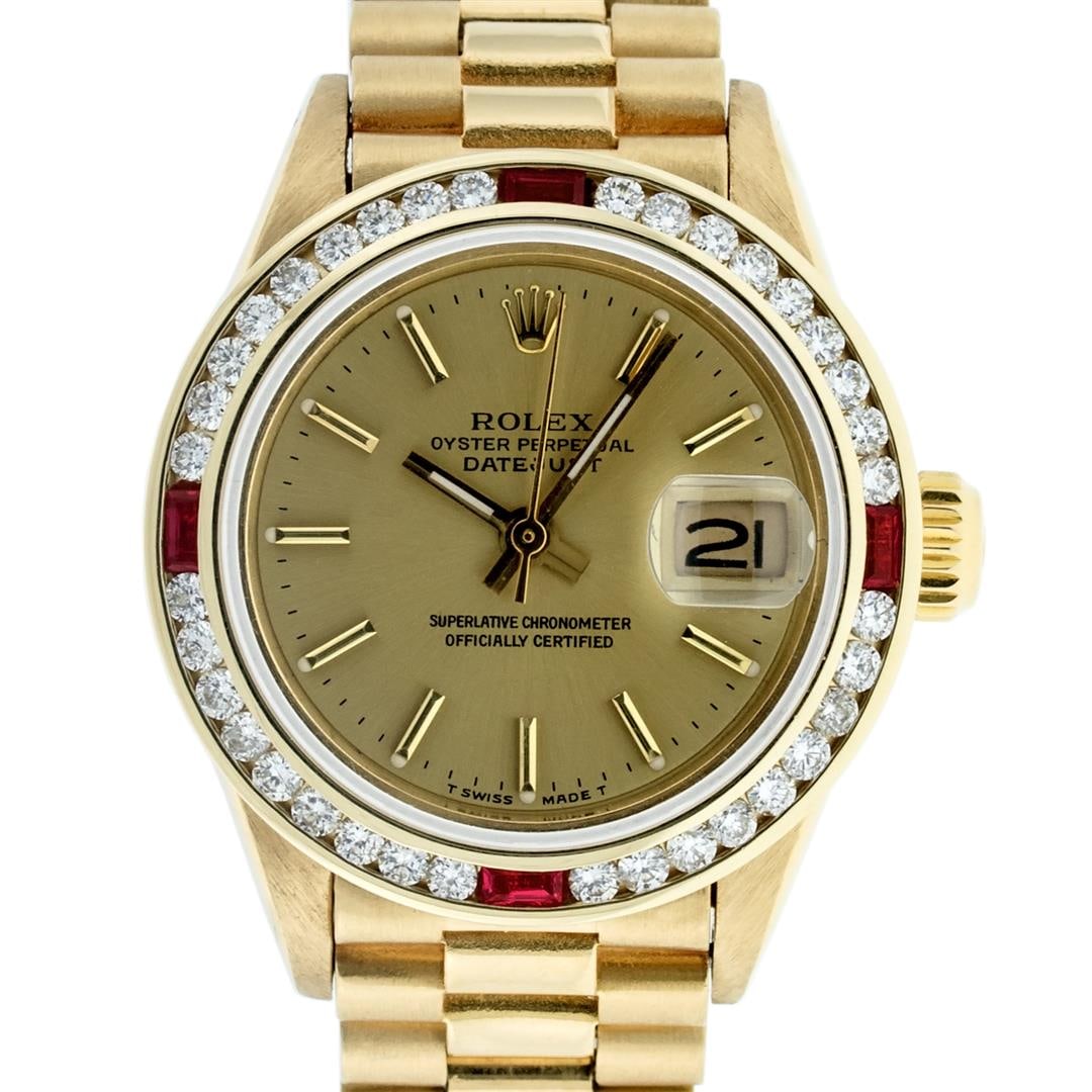 Rolex Ladies 18K Yellow Gold Ruby And Champagne Index President Wristwatch 26MM: One Ladies Pre Owned 18K Yellow Gold Rolex President Polished, Serviced & Electronically Tested, Rolex Yellow Gold Case: 26mm, Rolex 18K Yellow Gold Crown, Custom Bezel: New 18K Yellow Gold Bezel With