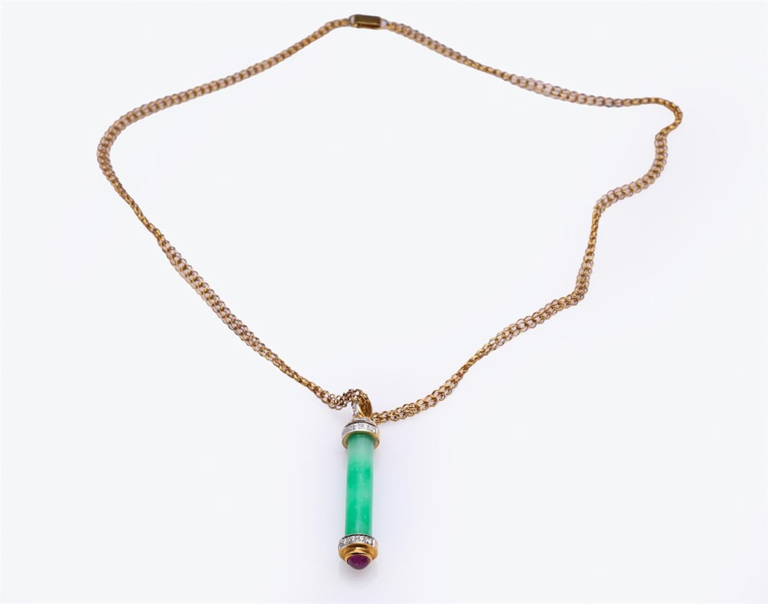 18K Yellow Gold Jadeite & Diamond Pendant by Carlo Rici: An interesting 18k yellow gold mounted apple green jadeite column with diamonds and a fine colored ruby cabochon bezel set finial complete with handmade link chain; designed by Carlo Rici; gross weigh