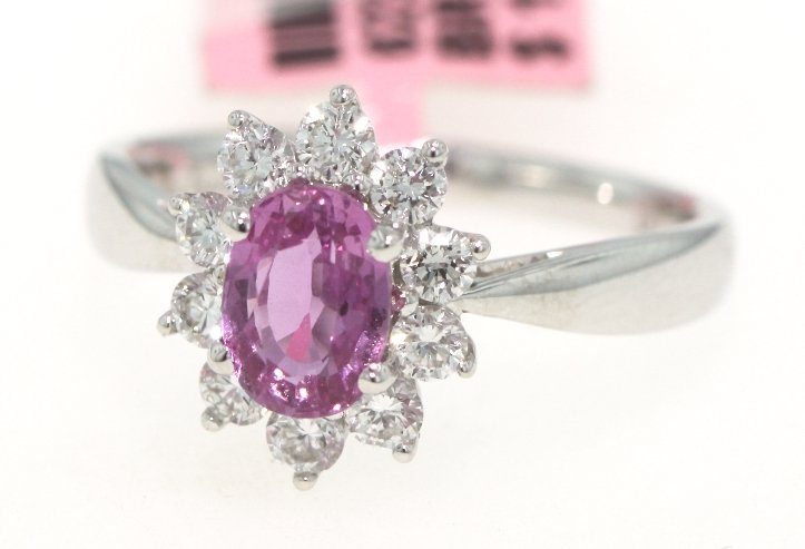 18KT White Gold 1.2ct Pink Sapphire and Diamond Ring FJ: 18KT White Gold 1.2ct Pink Sapphire and Diamond Ring FJM1147. Excellent Condition! JS1901CI. One 18KT white gold H. Emperor pink sapphire and diamond ring. Features one pink sapphire weighing 1.20cts 