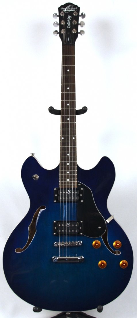 Oscar Schmidt/Washburn Blue Electric Guitar DGUI113: Oscar Schmidt/Washburn Blue Electric Guitar DGUI113. Excellent Condition! FJ771CV. This Oscar Schmidt / Washburn designed blue electric guitar is an incredible value. The Dot inlay and Stop tailpiece 