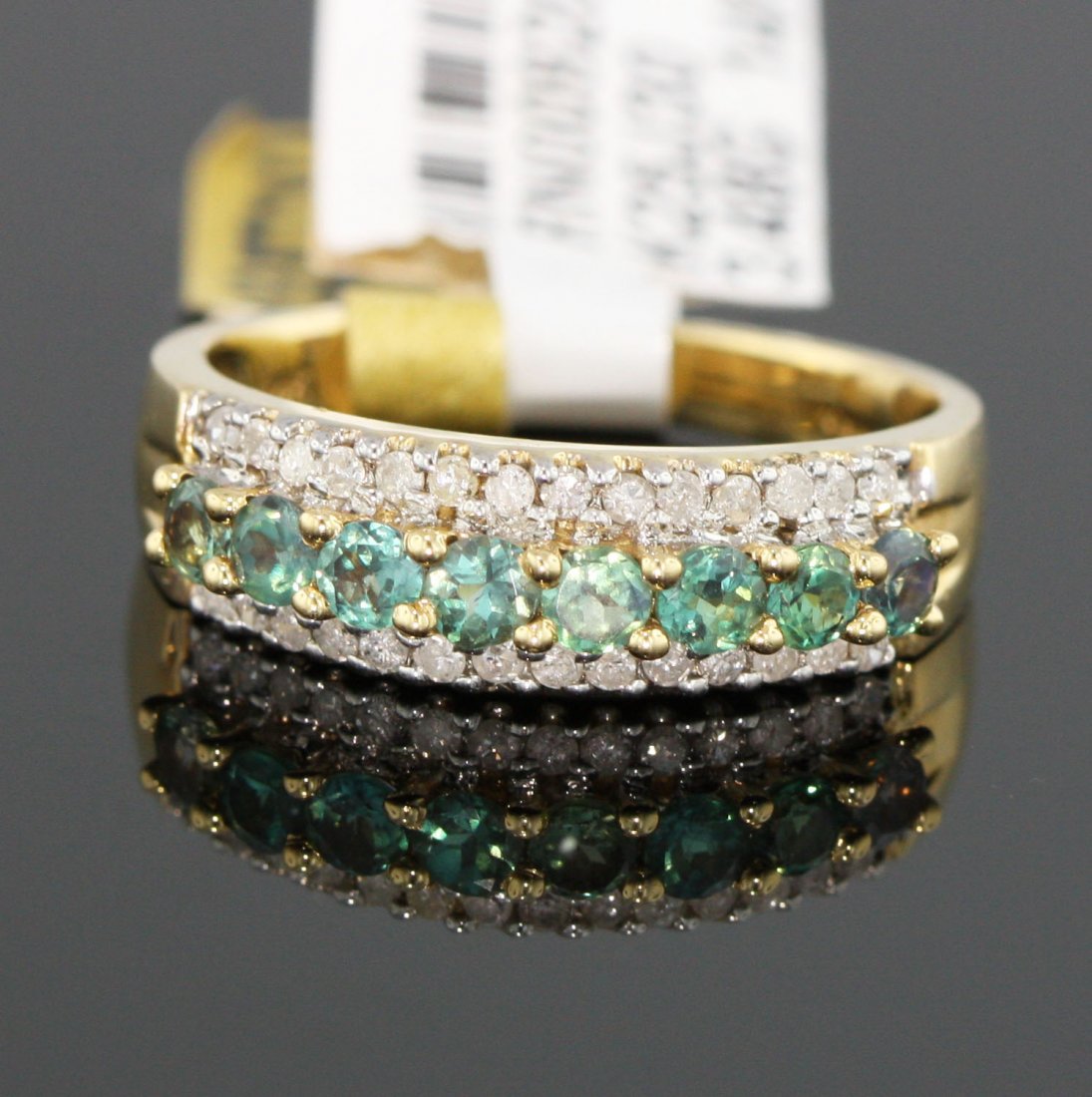 14KT Yellow Gold 0.70tcw Alexandrite and Diamond Ring R: 14KT Yellow Gold 0.70tcw Alexandrite and Diamond Ring RM622. Excellent Condition! PP168GY. One yellow gold ring stamped 14k" containing natural alexandrites. The ring also contains 28 round brilliant