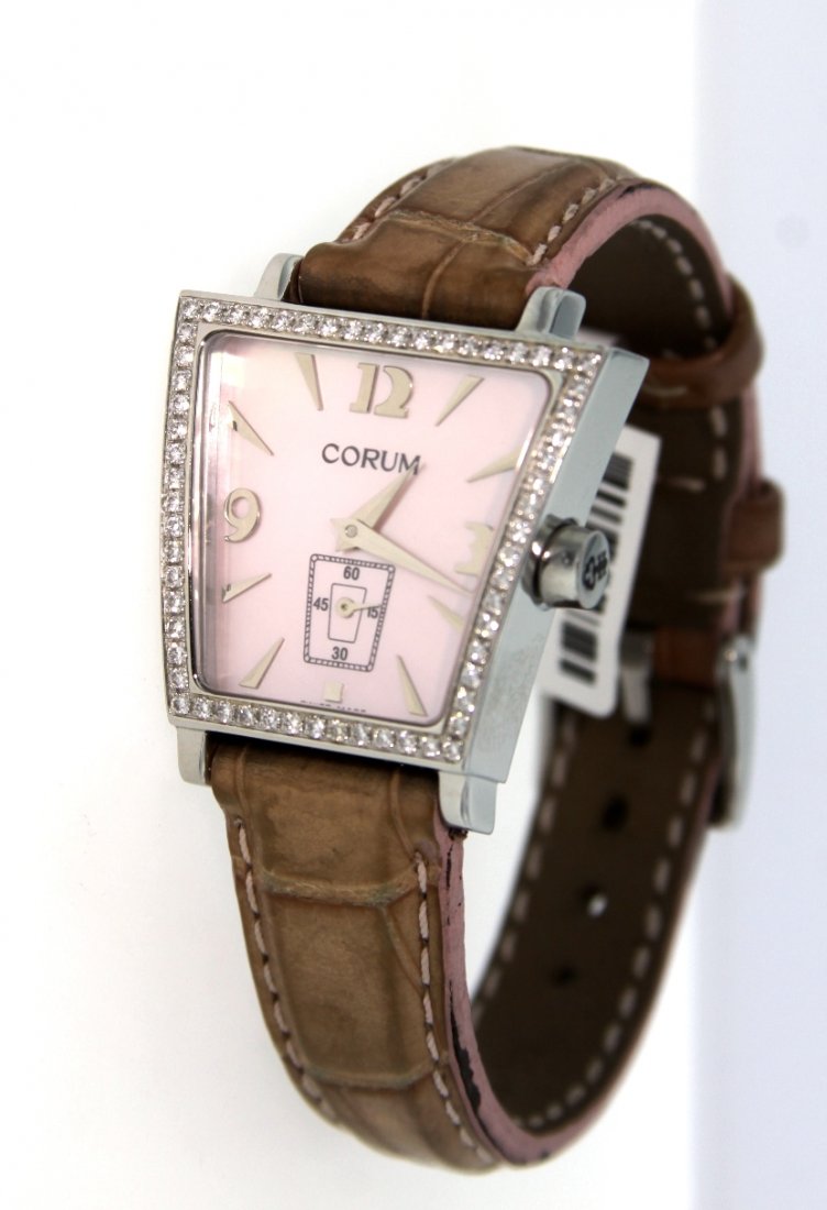 Ladies Corum Trapeze Quartz 105.404.47 with Diamonds Wa: Ladies Corum Trapeze Quartz 105.404.47 with Diamonds Watch GB14. Great Condition! FD1001MN. One ladies Corum Trapeze Quartz 105.404.47 with Diamonds Watch. This watch features a stainless steel base w