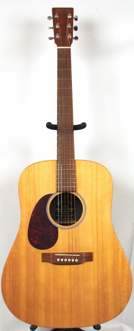 Martin DX1 Acoustic Guitar DGUI73: Martin DX1 Acoustic Guitar DGUI73. Excellent Condition! ZB243FJ.The DX1's top is a solid sitka spruce top and crossbracing for maximum projection. The DX1's back and sides are constructed of Martin's 