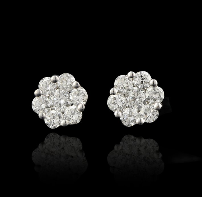 14KT White Gold 1.24ctw Diamond Stud Flower Earrings FJ: 14KT White Gold 1.24ctw Diamond Stud Flower Earrings FJM1916. Excellent Condition! XM328WE. One pair of earrings containing: 2.00 grams of 14KT White Gold, and (14) Round cut diamonds weighing a total
