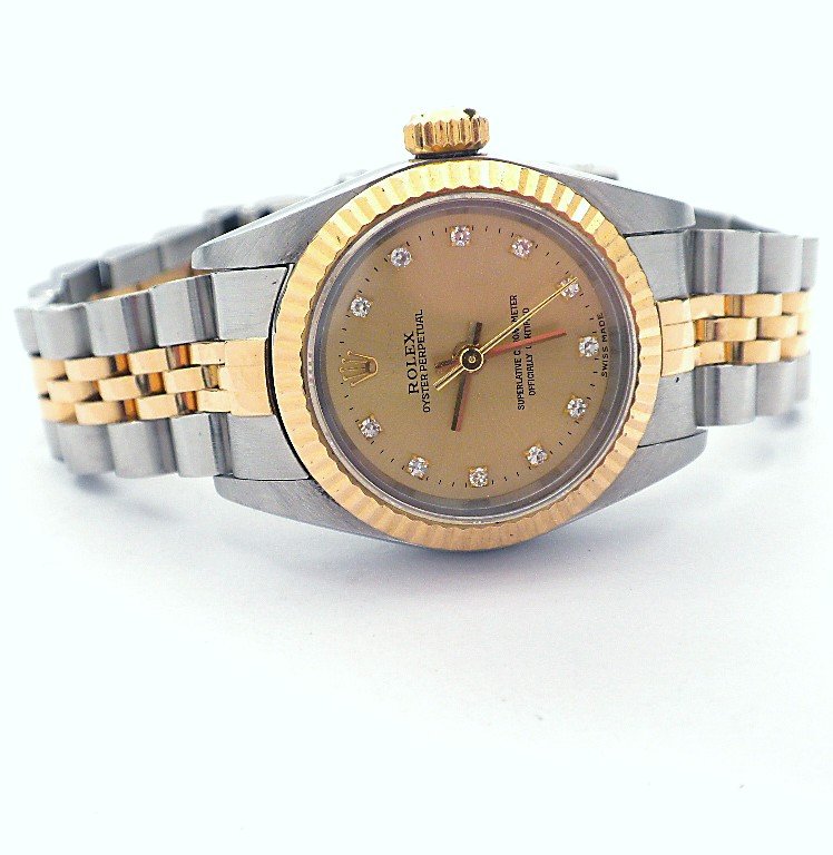 Lady Rolex Two-Tone Oyster Perpetual Wristwatch A3431: Lady Rolex Two-Tone Oyster Perpetual Wristwatch A3431. Great Condition! TR1012EA. One ladies, hand crafted and machine milled Rolex Oyster Perpetual Model stainless steel and 18KT yellow gold wristwat