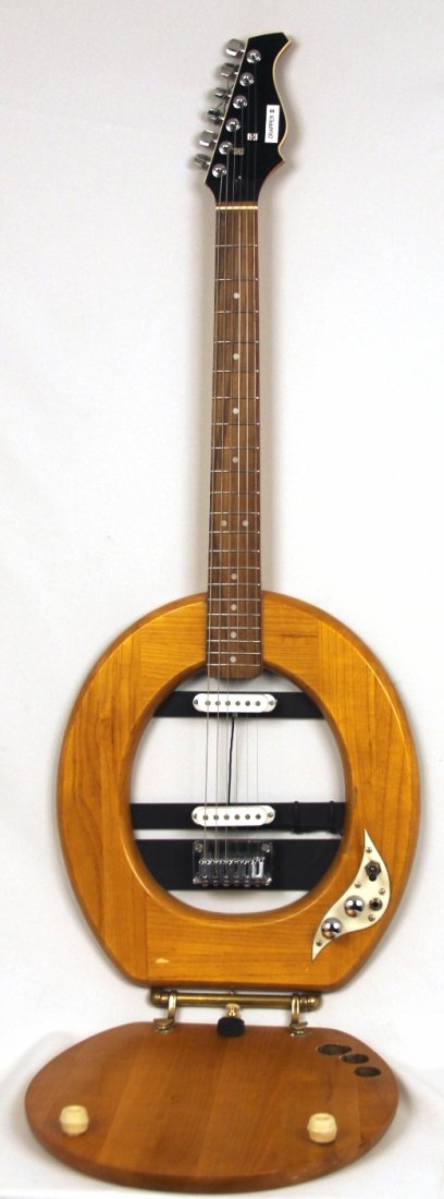 Crapper II Toilet Electric Wood Guitar DGUI91: Crapper II Toilet Electric Wood Guitar DGUI91. Good Condition! HJ752WE. This cool and totally playable electric Crapper II Toilet wood guitar is fun to play or just use as a cool wallhanger. Have a gu