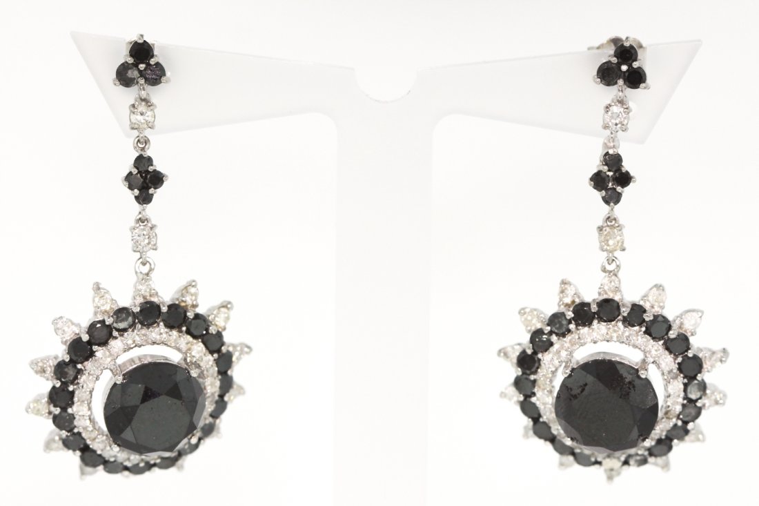 14KT White Gold 13.87ct Black and White Diamond Earring: 14KT White Gold 13.87ct Black and White Diamond Earrings RM422. New Condition! JY3891TW. One lady's polished, stamped and electronically tested solid 14KT white gold pair of earrings mounted with: 2 l