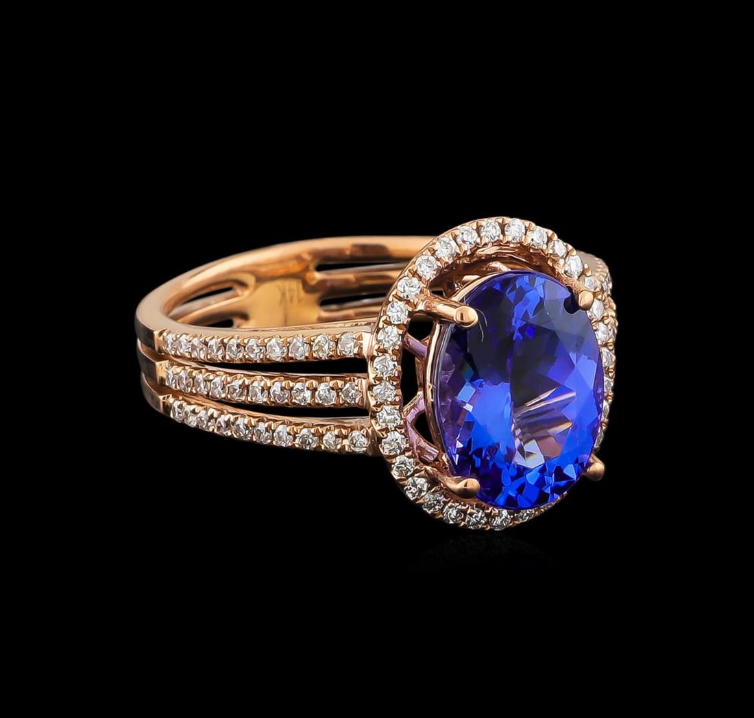 14KT Rose Gold 2.92 ctw Tanzanite and Diamond Ring: One electronically tested 14KT rose gold ladies combination cast & assembled tanzanite and diamond ring with a split shank with a bright polish finish. Identified with markings of "14K". Condition is 