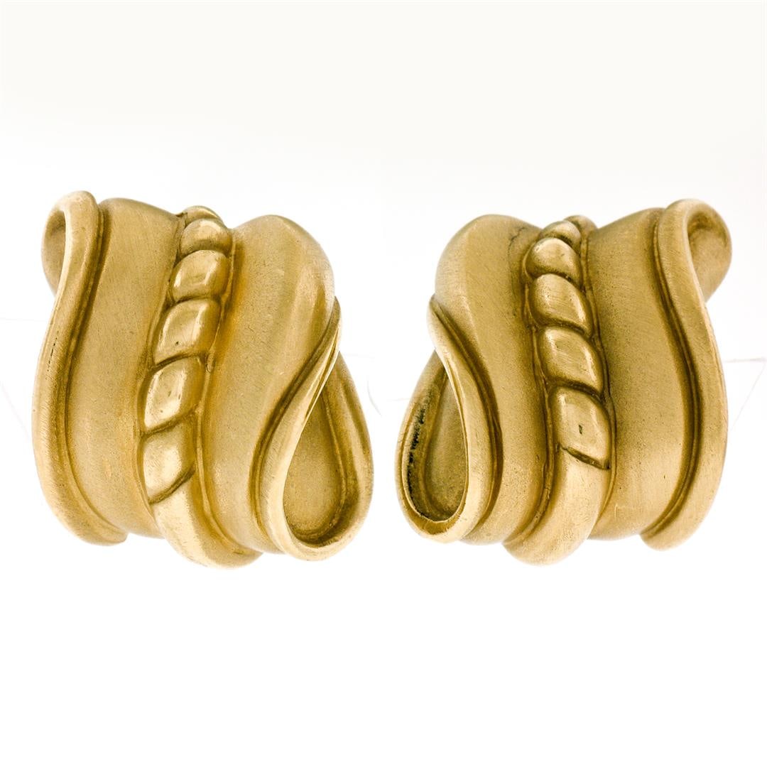 Vintage 1982 Kieselstein Cord 18k Yellow Gold Wavy Textured Clip On Earrings: A vintage solid 18k gold pair of wavy clip on earrings by Kieselstein Cord.The earrings measure approximately 23.30x21.20mm and weigh a total of 28.52grams.