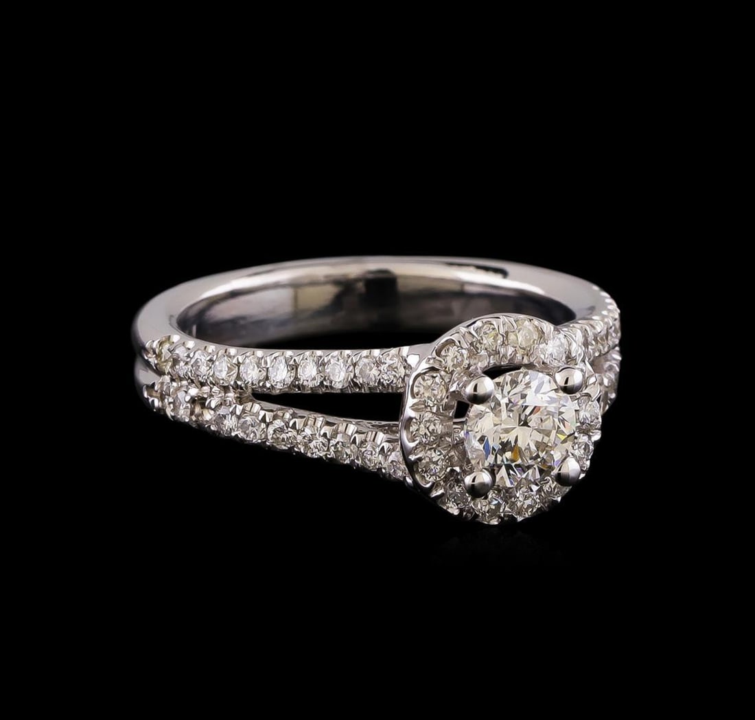 1.06 ctw Diamond Ring - 14KT White Gold: One electronically tested 14KT white gold lady's cast wedding ring with a split shank halo with a bright polish finish. The featured lady's ring has a double shank measuring 3.41 millimeters wide. Ide