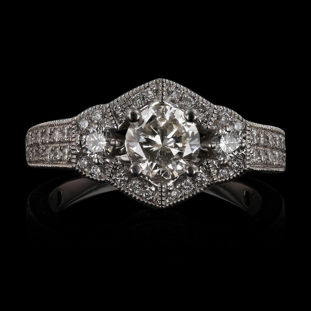 0.75 ctw CENTER Diamond Platinum Ring (1.60 ctw Diamonds): One electronically tested platinum ladies cast diamond unity ring. Condition is new, good workmanship. The featured diamond is set within a floral inspired diamond bezel, supported by an elaborate lat