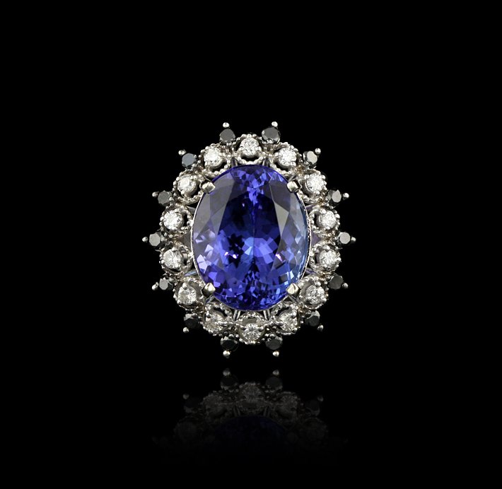 14KT White Gold 7.17ct Tanzanite, Black and White Diamo: 14KT White Gold 7.17ct Tanzanite, Black and White Diamond Ring A4147. Excellent Condition! ML3012RP. One electronically tested 14KT white gold ladies cast tanzanite diamond ring. Condition is new, goo