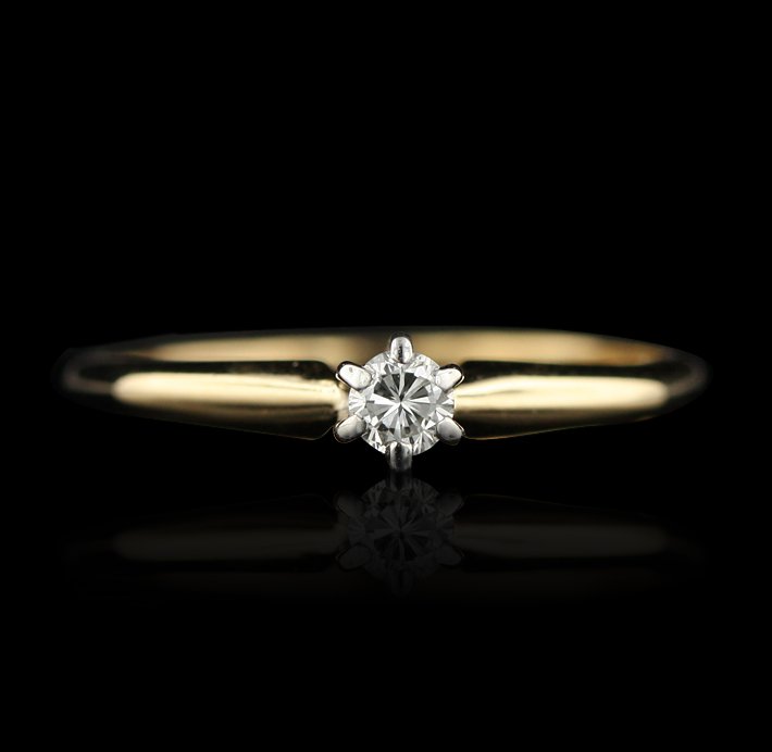 14KT Yellow Gold 0.10ctw Tiffany's Diamond Ring GB435: 14KT Yellow Gold 0.10ctw Tiffany's Diamond Ring GB435. Good Condition! EB951KO. One ring featuring: 2.0 Grams of 14KT Yellow Gold and 0.10ctw of Round Brilliant Diamonds. Thank you for viewing this lo