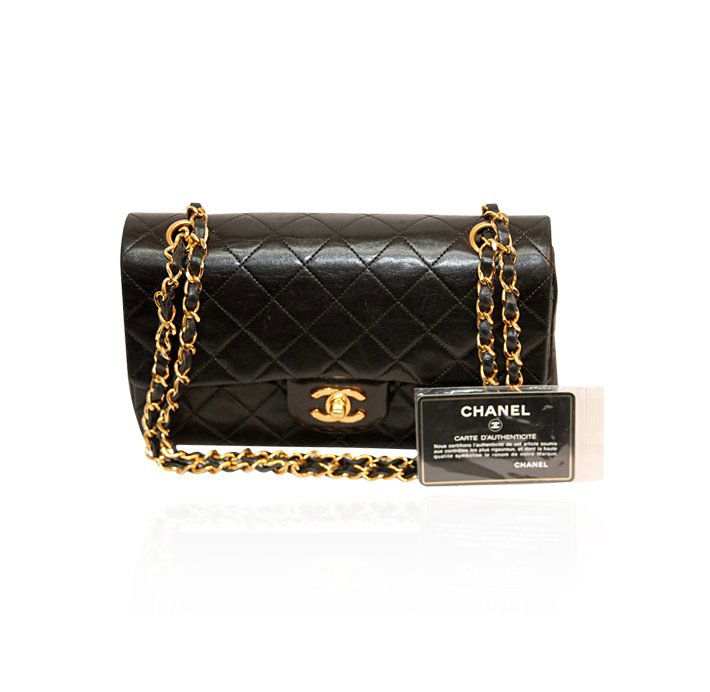 Authentic Chanel Quilted Lamb Leather Classic Double Fl: Authentic Chanel Quilted Lamb Leather Classic Double Flap Bag LB22. Good Pre-Owned Condition! XN9002EE. This is truly one bag that never goes out of style! The classic Chanel flap bags are iconic and