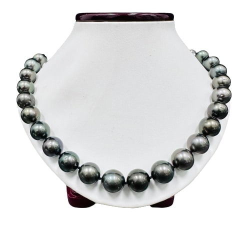 Pearl and Diamond Necklace - 14KT White Gold: One graduated single strand pearl necklace 18.2" princess length, knotted with a tongue clasp & foldover safety containing 31 Tahitian pearls, 14.3mm to 12.1mm in size. The pearls are black in color, 