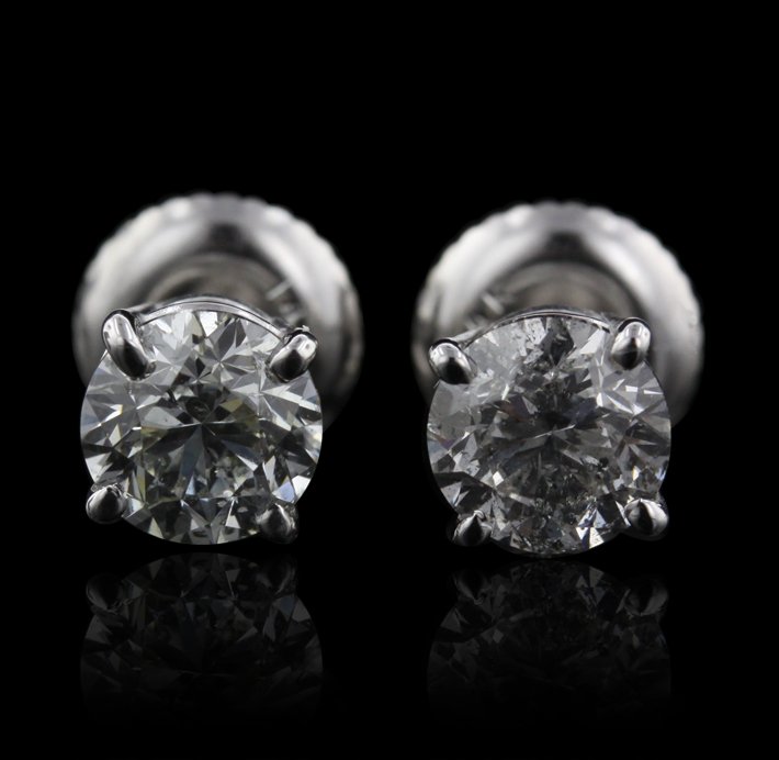 14KT White Gold 1.26ctw I1-I2/H-J Diamond Solitaire Ear: 14KT White Gold 1.26ctw I1-I2/H-J Diamond Solitaire Earrings A4438. Excellent Condition! PA169TC. One pair electronically tested 14KT white gold cast diamond solitaire earrings with screw backs. Condi